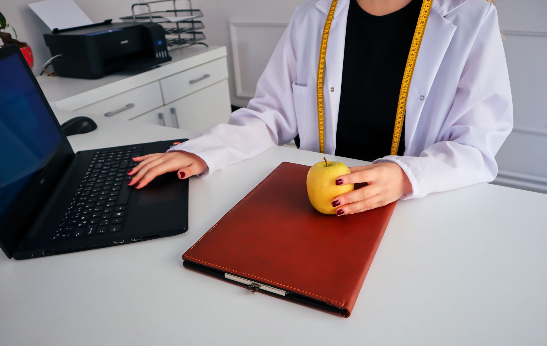 Expert dietician carefully planning healthy nutritional proportions with natural vegetables